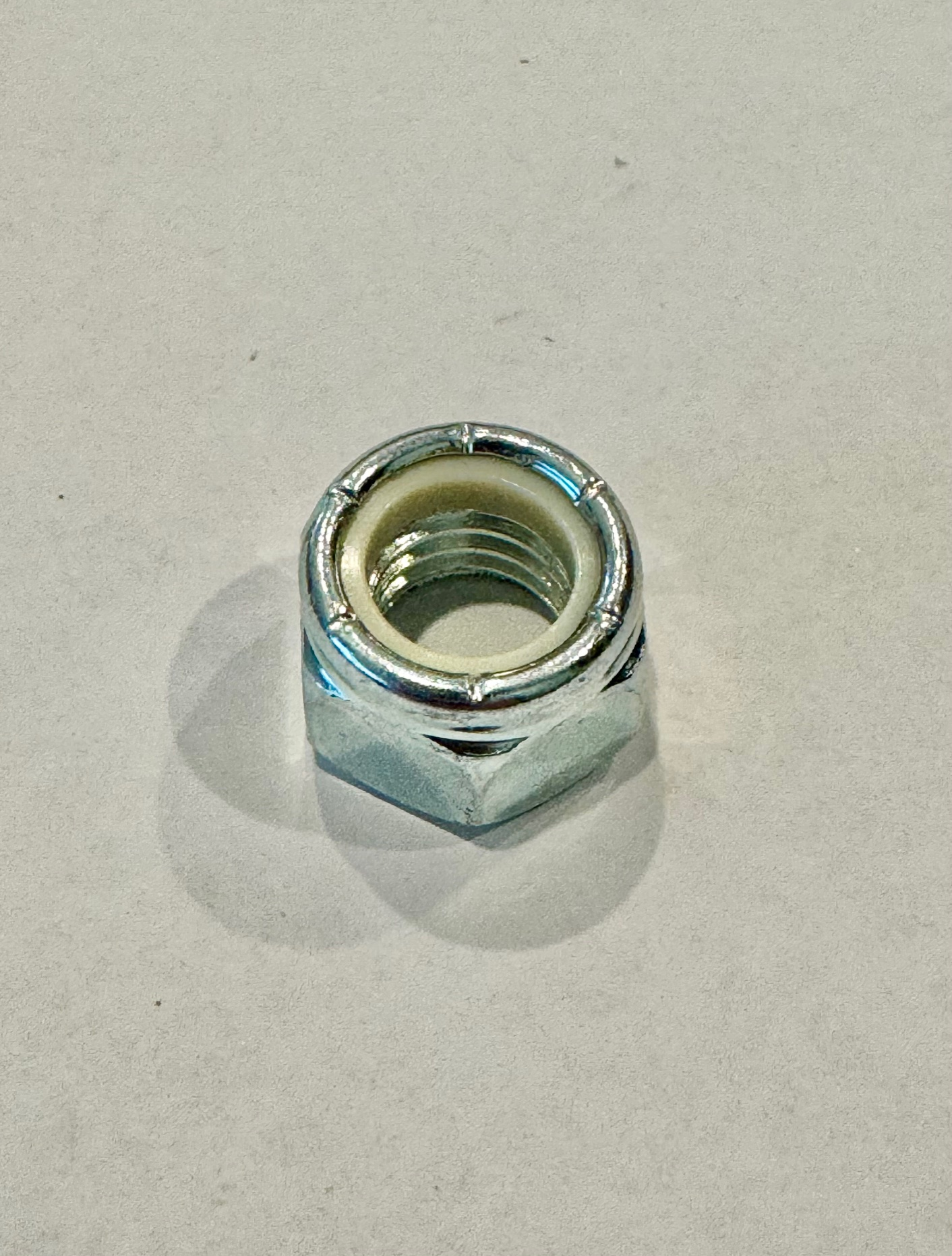 7/16-14 NYLOCK NUT (SILVER ZINC) [AA6981]